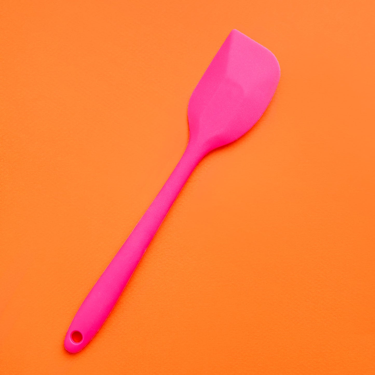 Mini Pink Spatula on a Orange Background