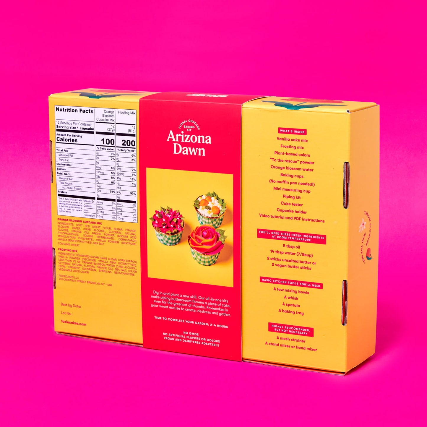 Back of Foxiecakes Arizona Dawn floral cupcake baking kit box on a pink background, showing nutrition facts, ingredient information, and a list of recommended basic tools you'll need for a beginner-friendly DIY orange blossom flavor cupcake decorating kit