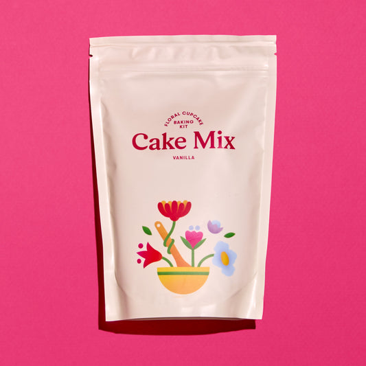 Foxiecakes package of vanilla cake mix with floral design on a pink background