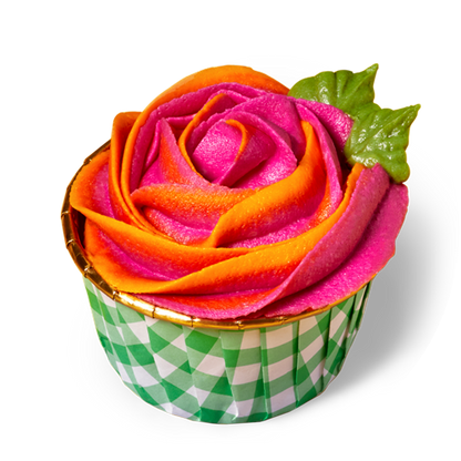 single colorful cupcake with pink and orange rose-style buttercream flower in a green gingham print cupcake cup
